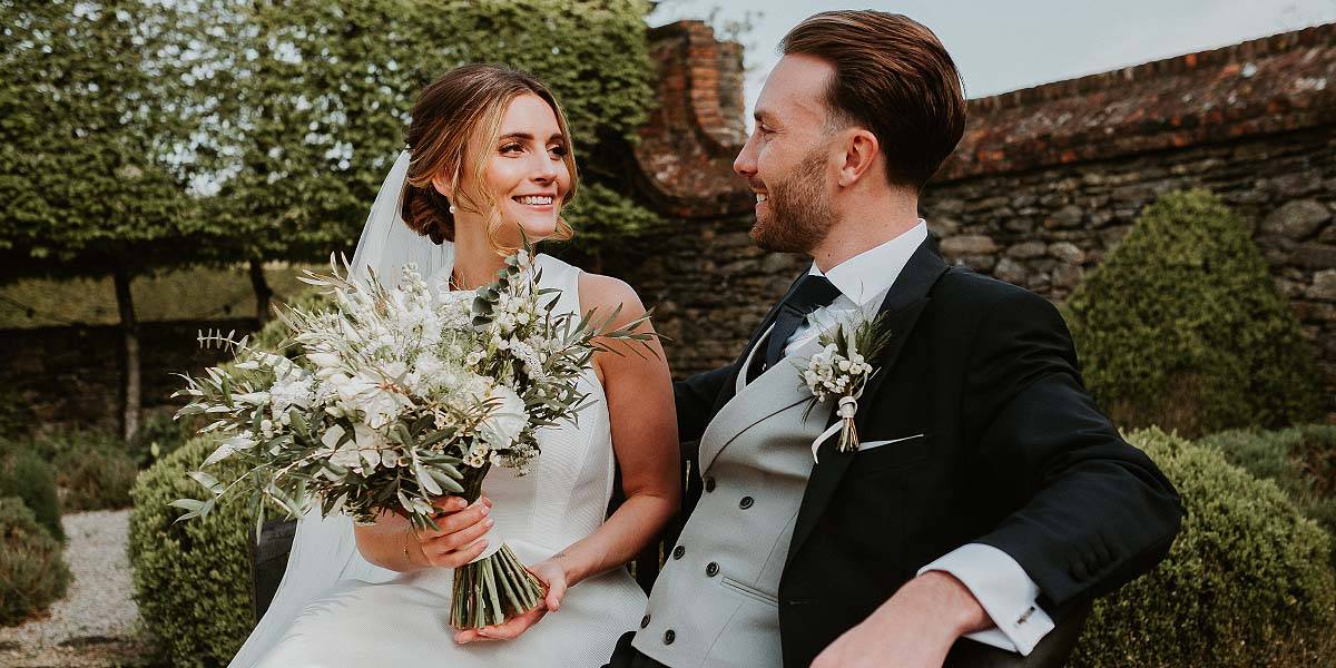 Wedding Florist Plymouth A smiling bride with a beautiful bridal bouquet created by Plymouth wedding florist Artem Florum.